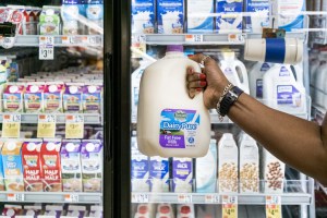 GettyImages-955713406-person-buying-gallon-of-dairy-pure-milk-dean-foods-owned