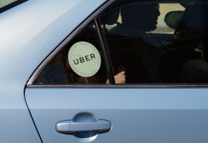 Uber car driving in the street of a city