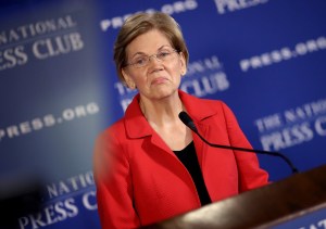 Elizabeth Warren at a microphone.