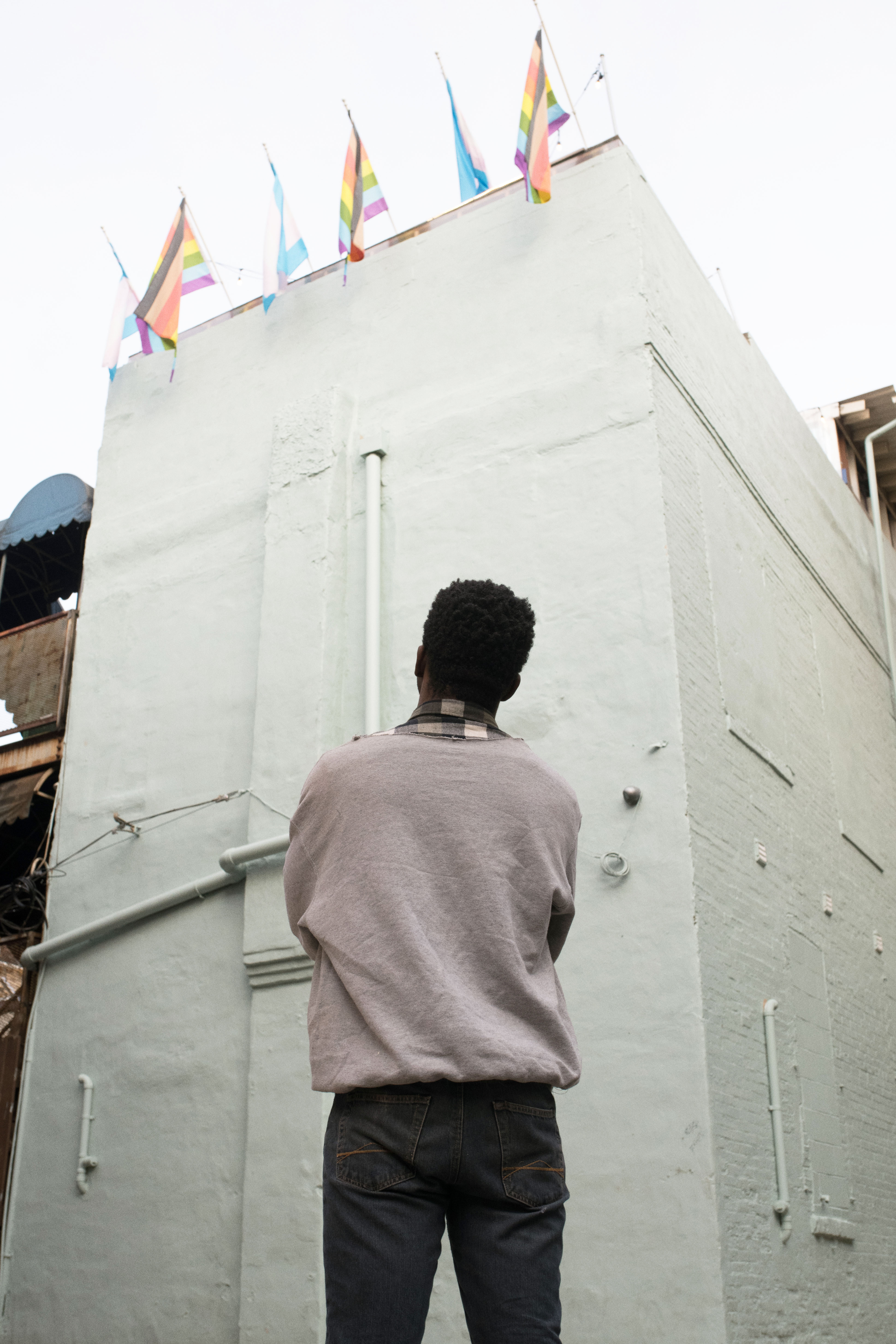 Mikal looking up at flags