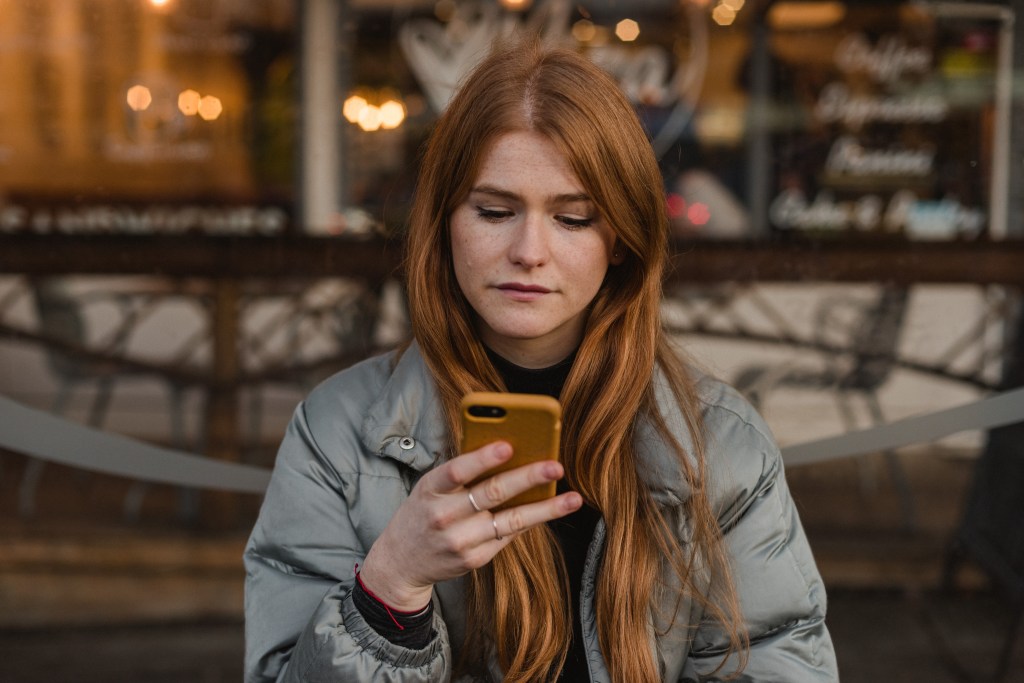 Laura Bell reading astrology app notifications