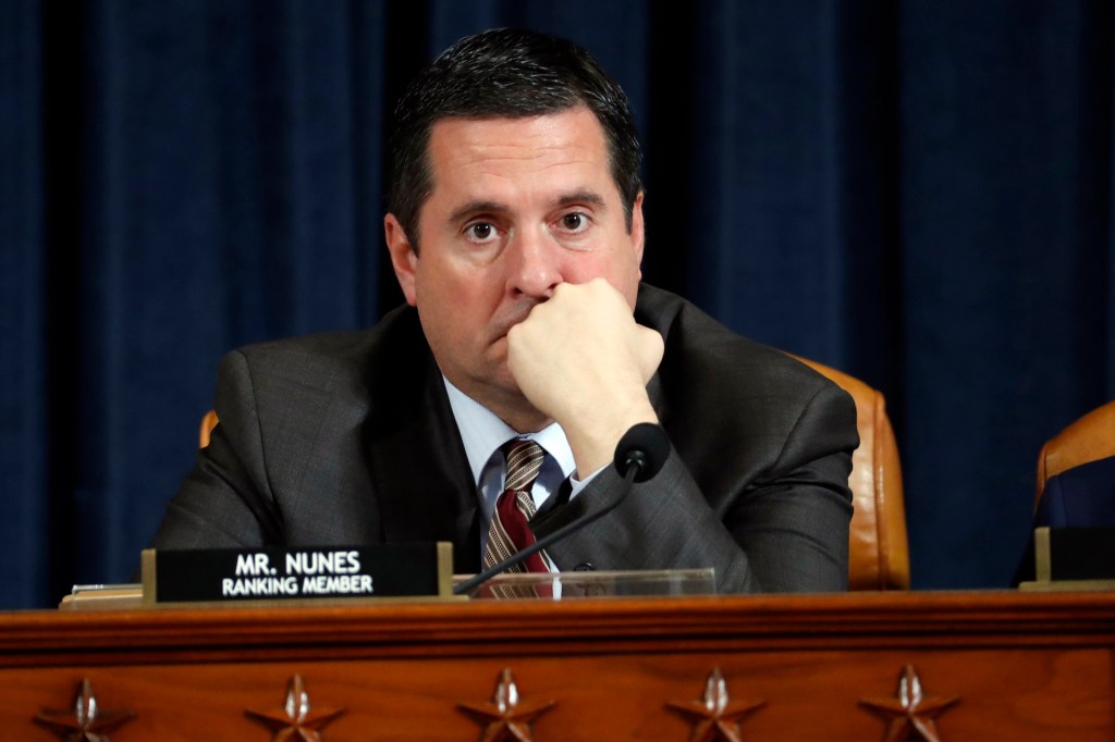 Ranking member Devin Nunes (R-CA) listens to Ambassador Kurt Volker, former special envoy to Ukraine, and Tim Morrison, a former official at the National Security Council, as they testify before the House Intelligence Committee on Capitol Hill November 19