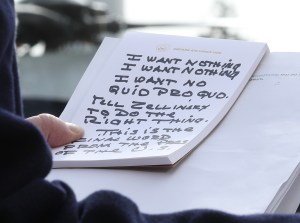 U.S. President Donald Trump holds his notes while speaking to the media before departing from the White House on November 20, 2019 in Washington, DC.