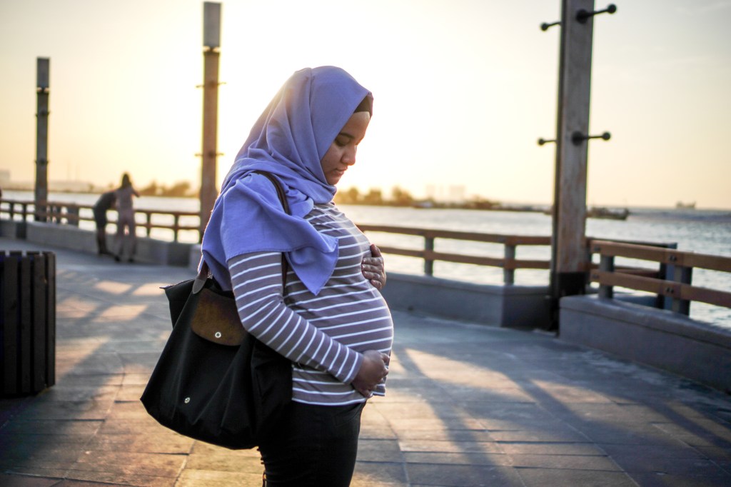 pregnant muslim woman wearing hijab