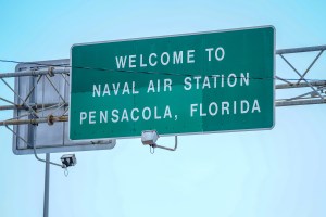 Signage located above the Bayou Grande Bridge leading to the Pensacola Naval Air Station following a shooting on December 06, 2019 in Pensacola, Florida.