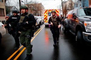 Video footage of the scene showed a massive police response, including SWAT teams and snipers positioned on nearby roofs.