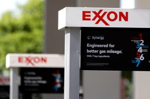 his April 25, 2017, file photo, shows Exxon service station signs in Nashville, Tenn. Exxon Mobil Corp. reports earnings Friday, Feb. 1, 2019.