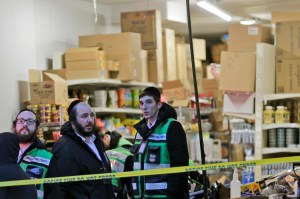 Emergency responders work at a kosher supermarket, the site of a shooting in Jersey City, N.J., Wednesday, Dec. 11, 2019. Jersey City Mayor Steven Fulop said gunmen targeted the market during a shooting that killed multiple people Tuesday. (AP Photo/Seth