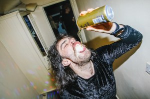 man chugging beer