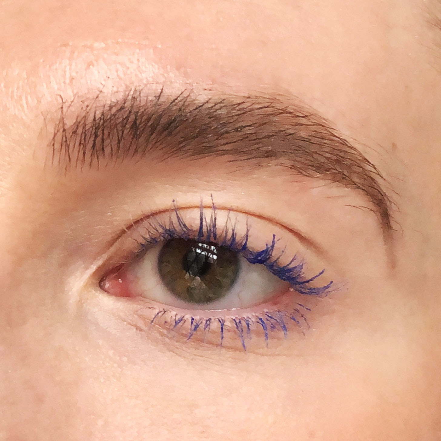 Eye with blue mascara