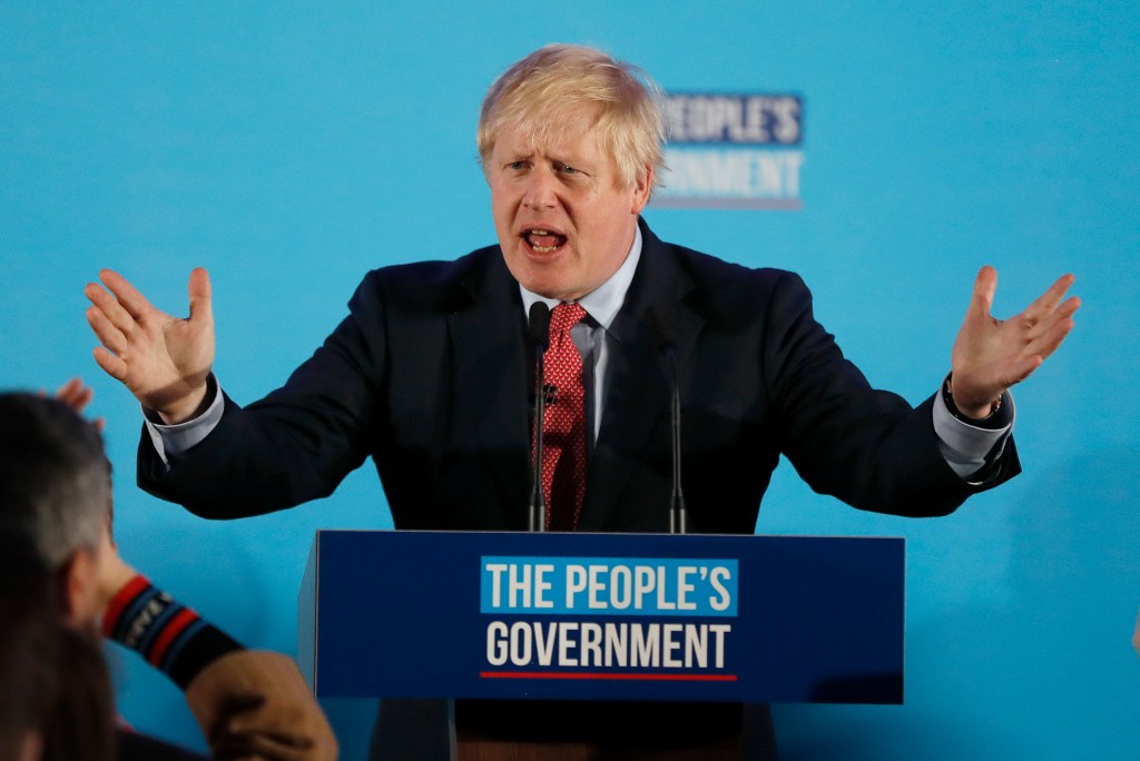 Britain's Prime Minister Boris Johnson speaks at a campaign event at the Queen Elizabeth II Centre in London, Friday, Dec. 13, 2019