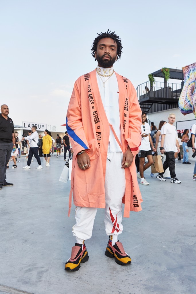 Pyer Moss creative director Kerby Jean-Raymond standing in the forecourt of Sole DXB wearing a full Pyer Moss look.