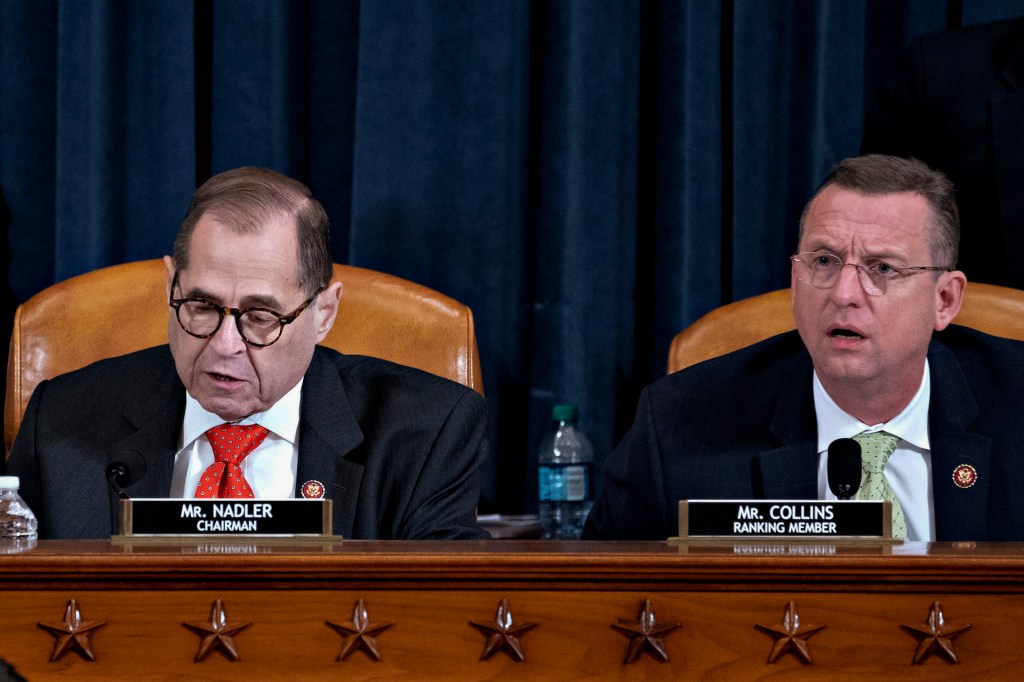 U.S. House Judiciary Committee Chairman Jerry Nadler (D-NY) (L) gavels to an adjournment the committee hearing on the articles of impeachment against President Donald Trump as ranking member Doug Collins (R-GA) looks on at the Longworth House Office Build