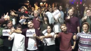 A screenshot of people holding up pro-Bloomberg signs