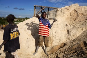 Boys mining cobalt in Congo that will be used in electronics sold by Apple, Google, Dell, Tesla, and Microsoft.