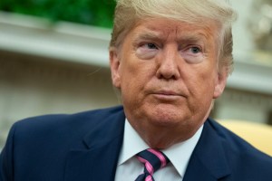 President Donald Trump listens to a question during a meeting in the Oval Office of the White House, Friday, Dec. 13, 2019, in Washington.