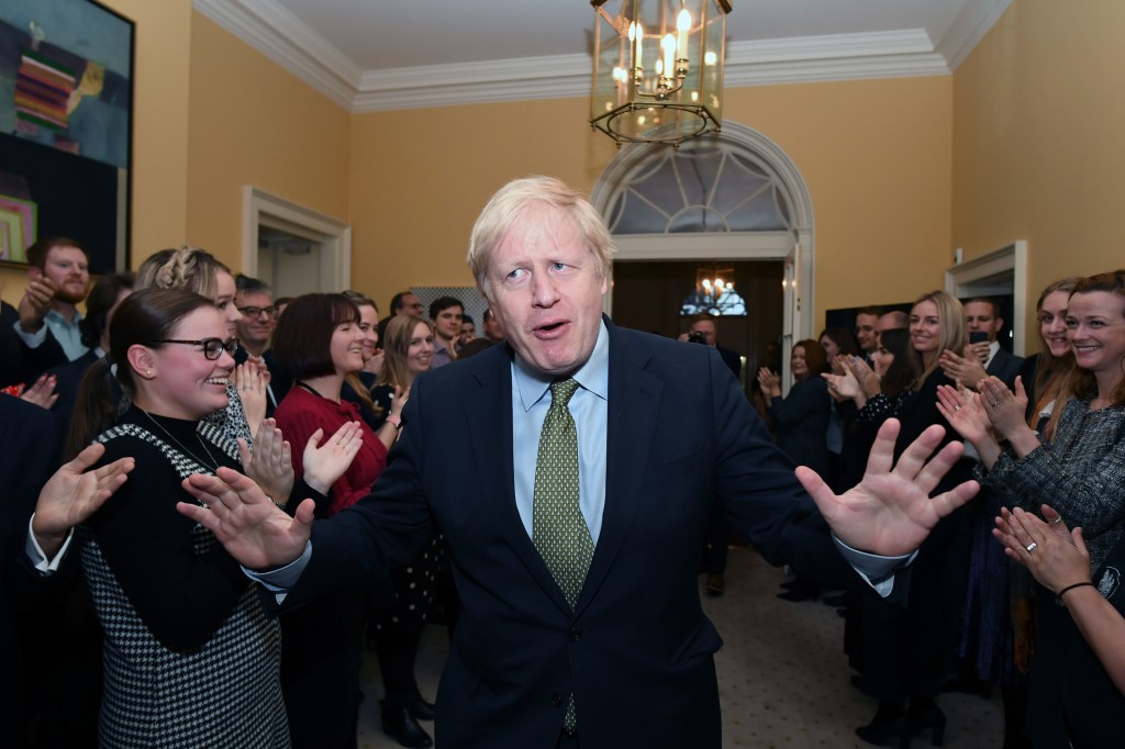 ​Boris Johnson greeted by Number 10 staff after the election