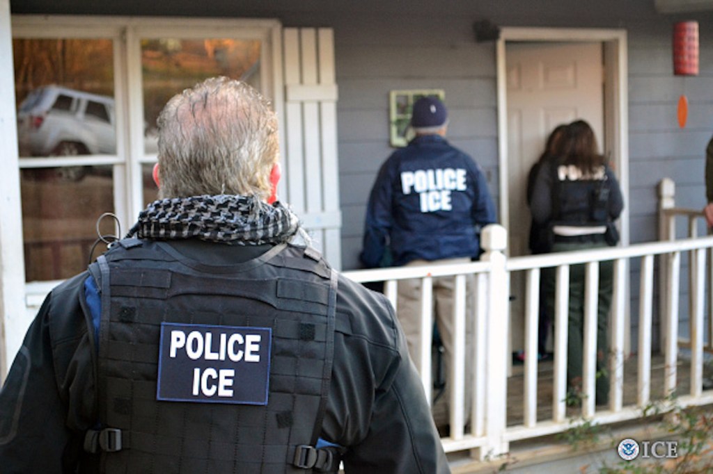 ICE officers in front of home