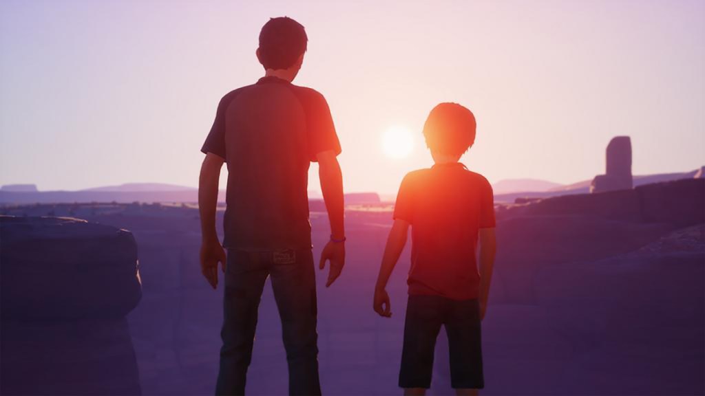 Screenshot from Life is Strange 2. A teenager and a young boy stand at the edge of the grand canyon, watching the sun rise.