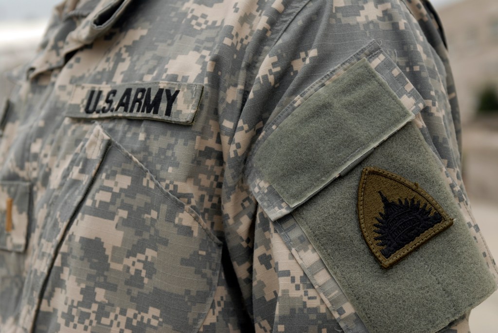 An Army National Guard soldier is photographed in front of the DC Armory.