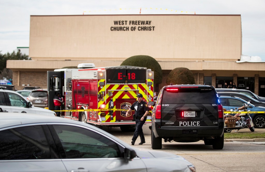 Police and fire departments surround the scene of a shooting at West Freeway Church of Christ in White Settlement, Texas,