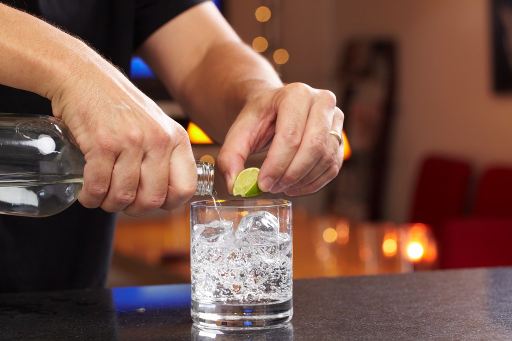 Seltzer with lime at bar sobriety