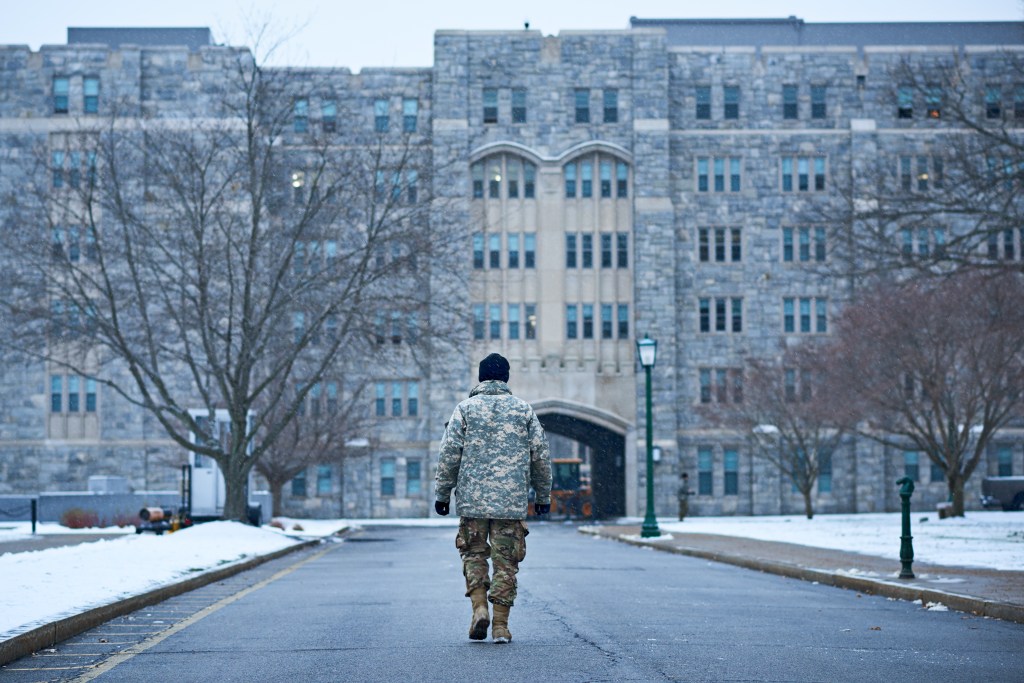 Soldier walking towards a building