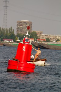 Girl holding on to a buoy