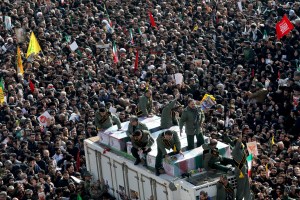 Coffins of Gen. Qassem Soleimani and others who were killed in Iraq by a U.S. drone strike, are carried on a truck surrounded by mourners during a funeral procession