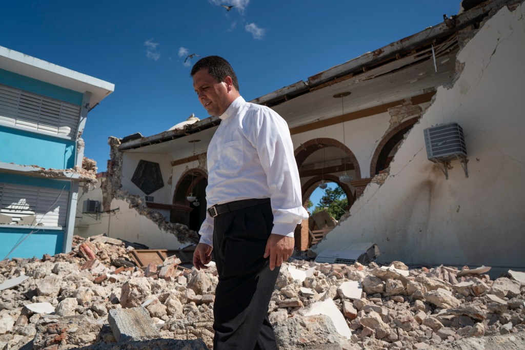 Father Melvin Diaz Aponte inspects damage to the Parroquia Inmaculada Concepción church after a 6.4 earthquake hit just south of the island on January 7, 2020 in Guayanilla, Puerto Rico.