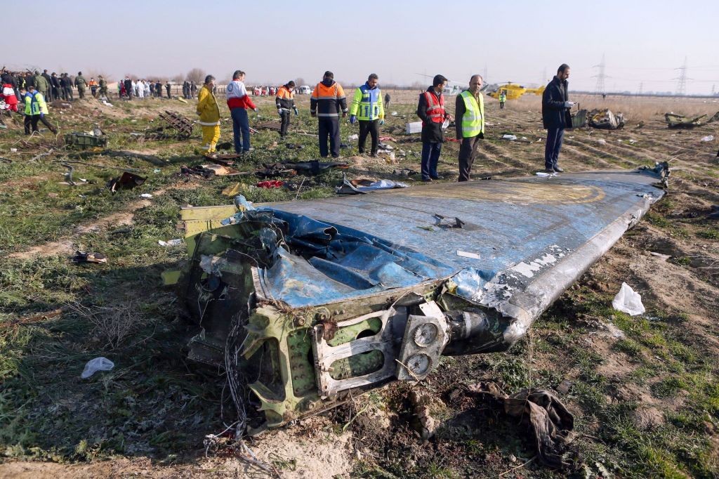 Rescue teams are seen on January 8, 2020 at the scene of a Ukrainian airliner that crashed shortly after take-off near Imam Khomeini airport in the Iranian capital Tehran.