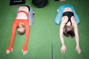 two women child's pose