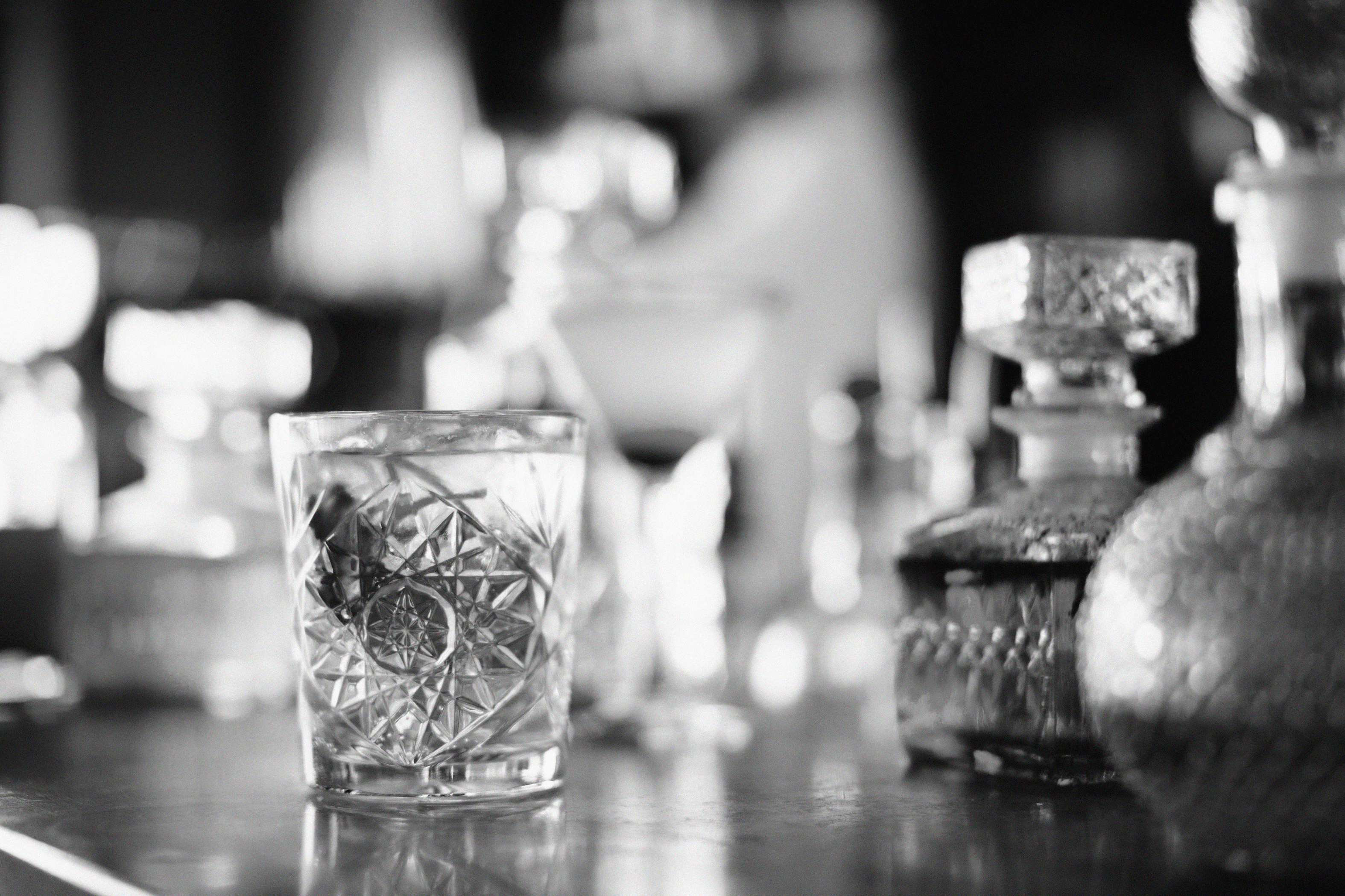 Prohibition era cocktail in a crystal rocks glass on bar