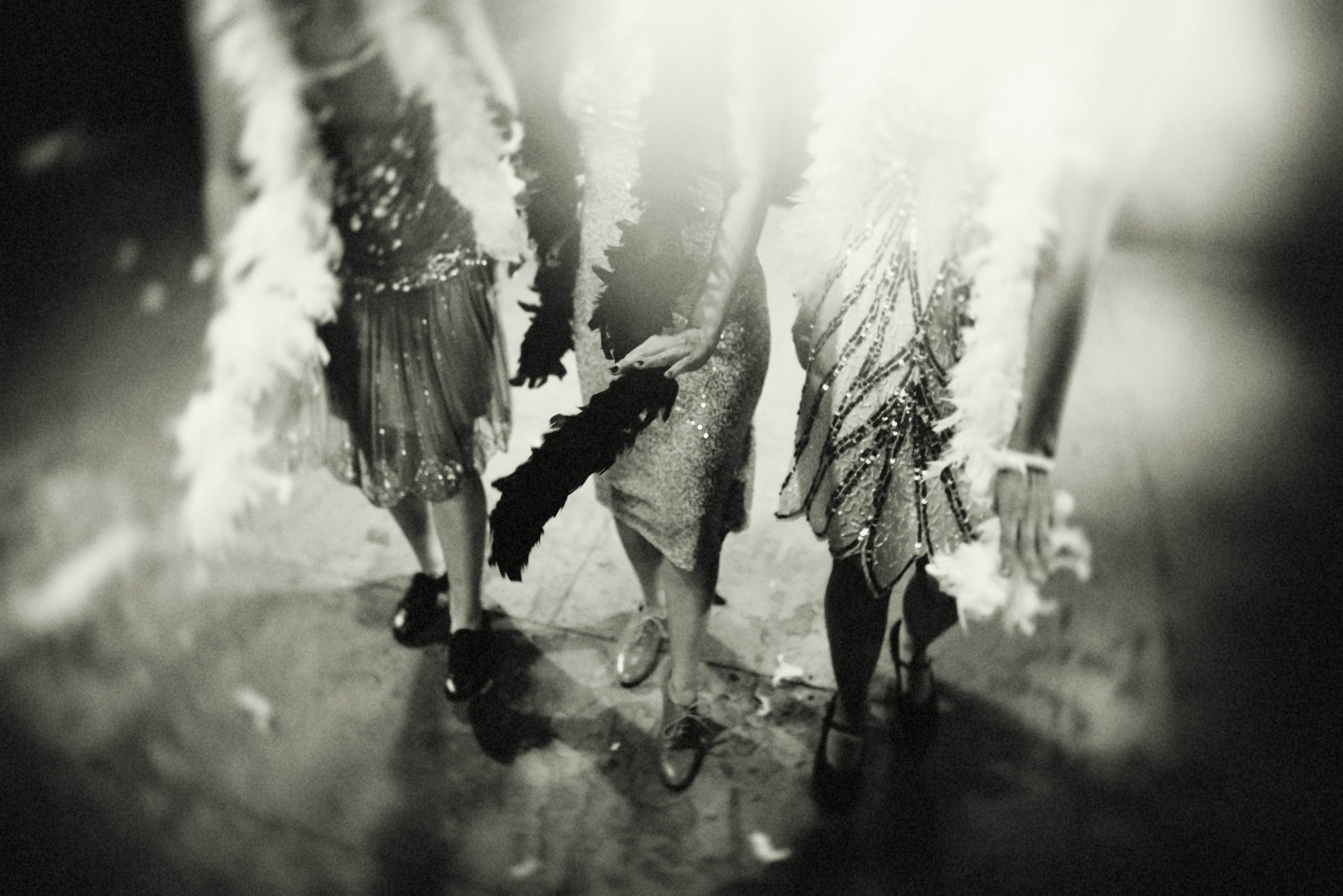 Black and white photo of women dressed as 1920s flappers