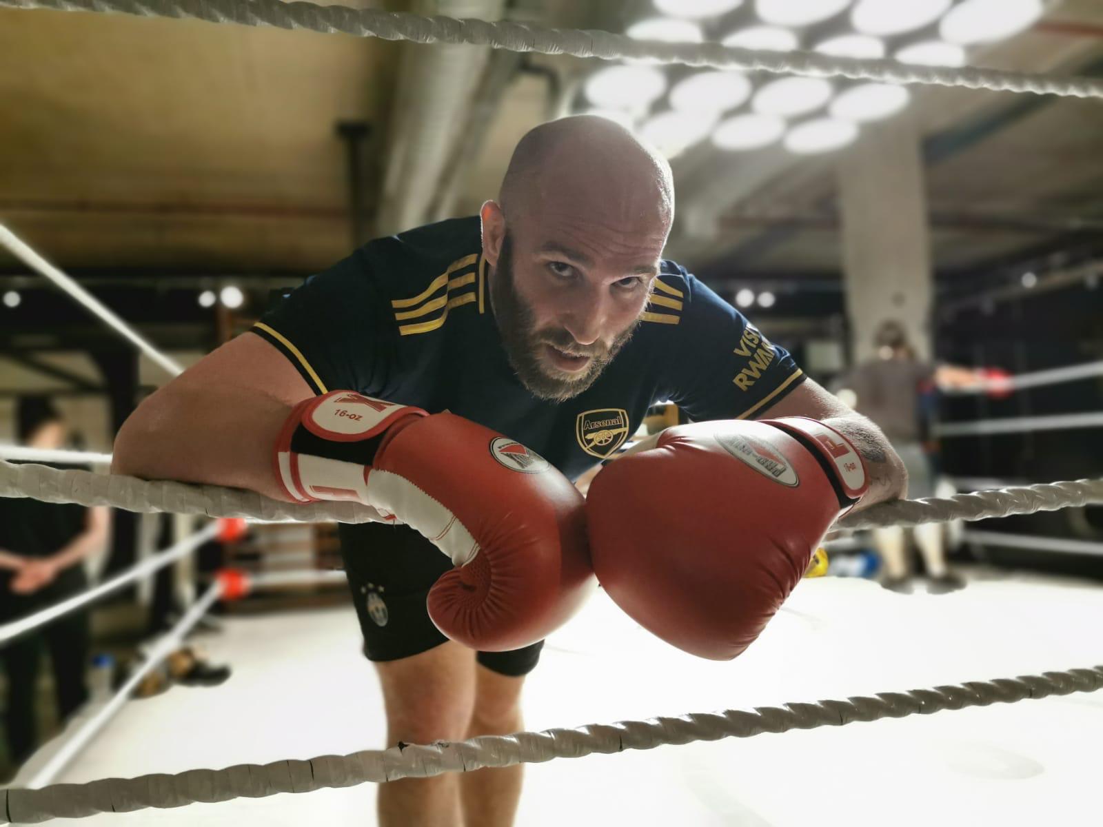 man exhausted boxing ring