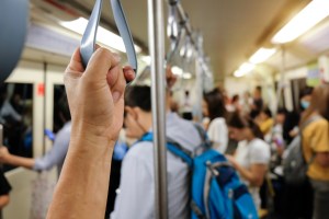 hand holding strap on train