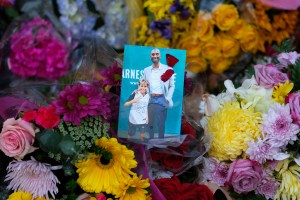 A picture and flowers are placed at a memorial for Kobe Bryant near Staples Center Monday, Jan. 27, 2020, in Los Angeles.