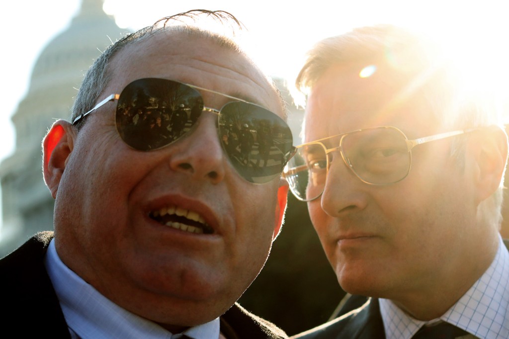 Lev Parnas, former associate of Rudy Giuliani, (L) answers questions from members of the media as his attorney Joseph Bondy listens on the grounds of the U.S. Capitol January 29, 2020 on Capitol Hill in Washington, DC.