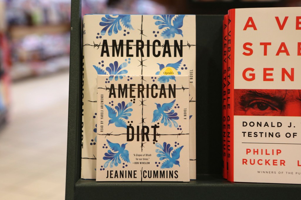 "American Dirt," a novel by Jeanine Cummins and Oprah's Book club selection, is seen on the shelves at a Barnes & Noble in Brooklyn, N.Y. on Thursday, Jan. 30, 2020. (AP Photo/Julia Weeks)