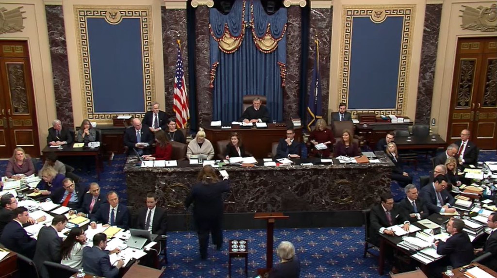 WASHINGTON, DC - JANUARY 29: In this screengrab taken from a Senate Television webcast, Chief Justice John Roberts receives a question from a senator during impeachment proceedings against U.S. President Donald Trump in the Senate at the U.S. Capitol on J