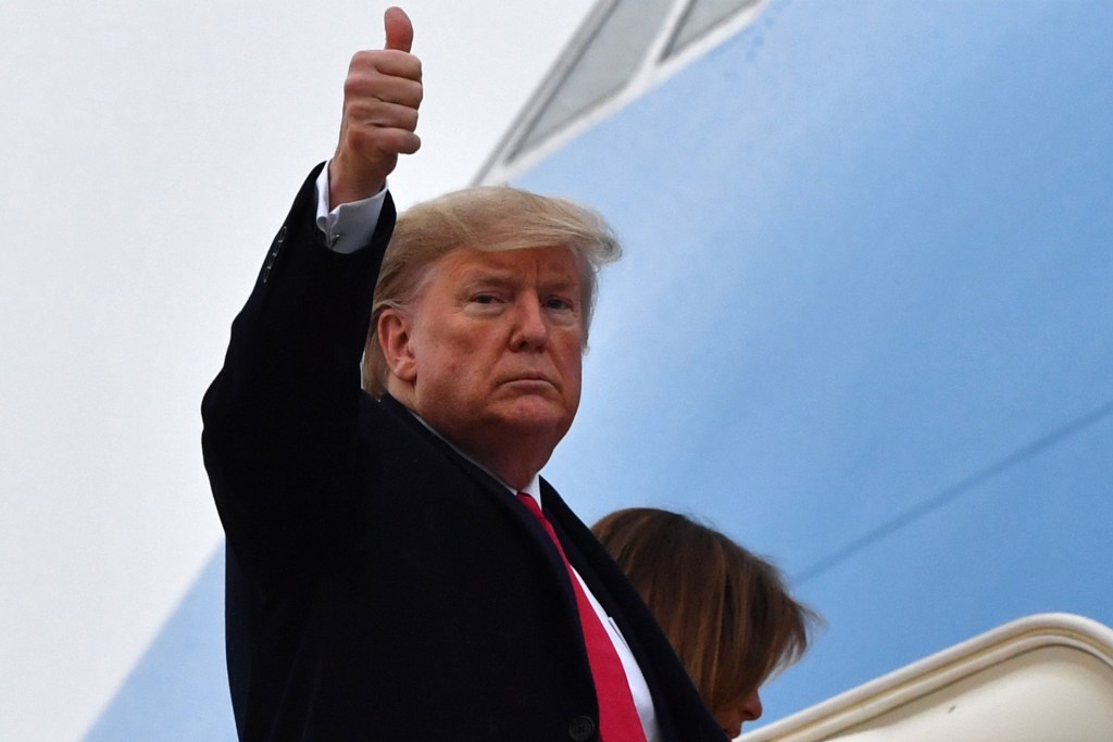 US President Donald Trump gives a thumbs up as he boards Air Force One prior to departure from Joint Base Andrews in Maryland, January 31, 2020, as he travels to Palm Beach, Florida.