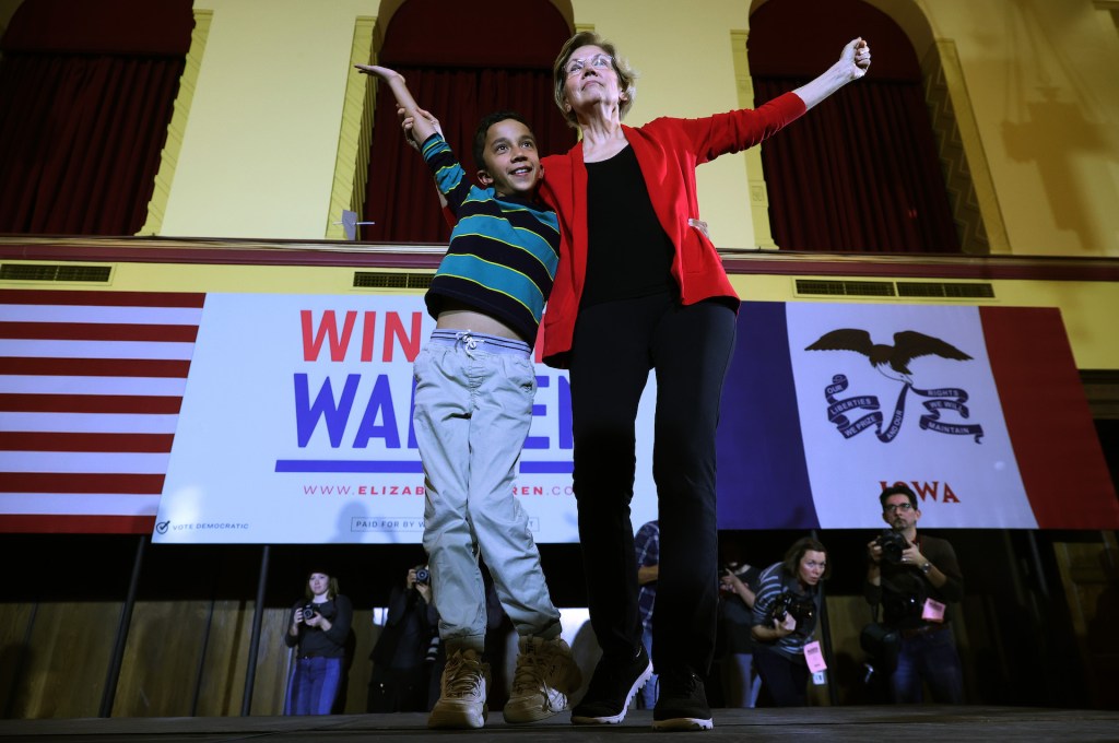 Democratic presidential candidate Sen. Elizabeth Warren (D-MA) dances with her grandson Atticus Tyagi, 9, at the conclusion of a campaign event at Iowa State University's Memorial Union February 02, 2020 in Ames, Iowa.