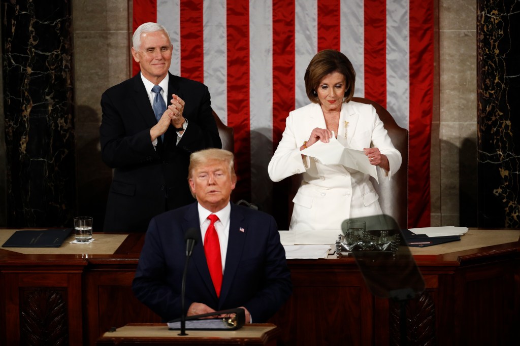 House Speaker Nancy Pelosi of Calif., tears her copy of President Donald Trump's s State of the Union address after he delivered it to a joint session of Congress on Capitol Hill in Washington, Tuesday, Feb. 4, 2020. Vice President Mike Pence is at left.