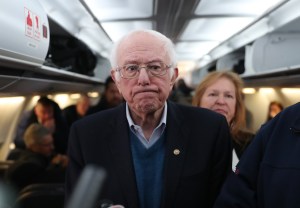 Democratic presidential candidate Sen. Bernie Sanders (I-VT) speaks to the media after boarding the plane at the Des Moines International Airport on February 04, 2020 in Des Moines, Iowa. Mr. Sanders was heading to Manchester, New Hampshire to campaign le