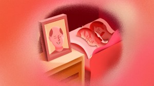 A woman and man sleep next to a photo of the woman's dead spouse