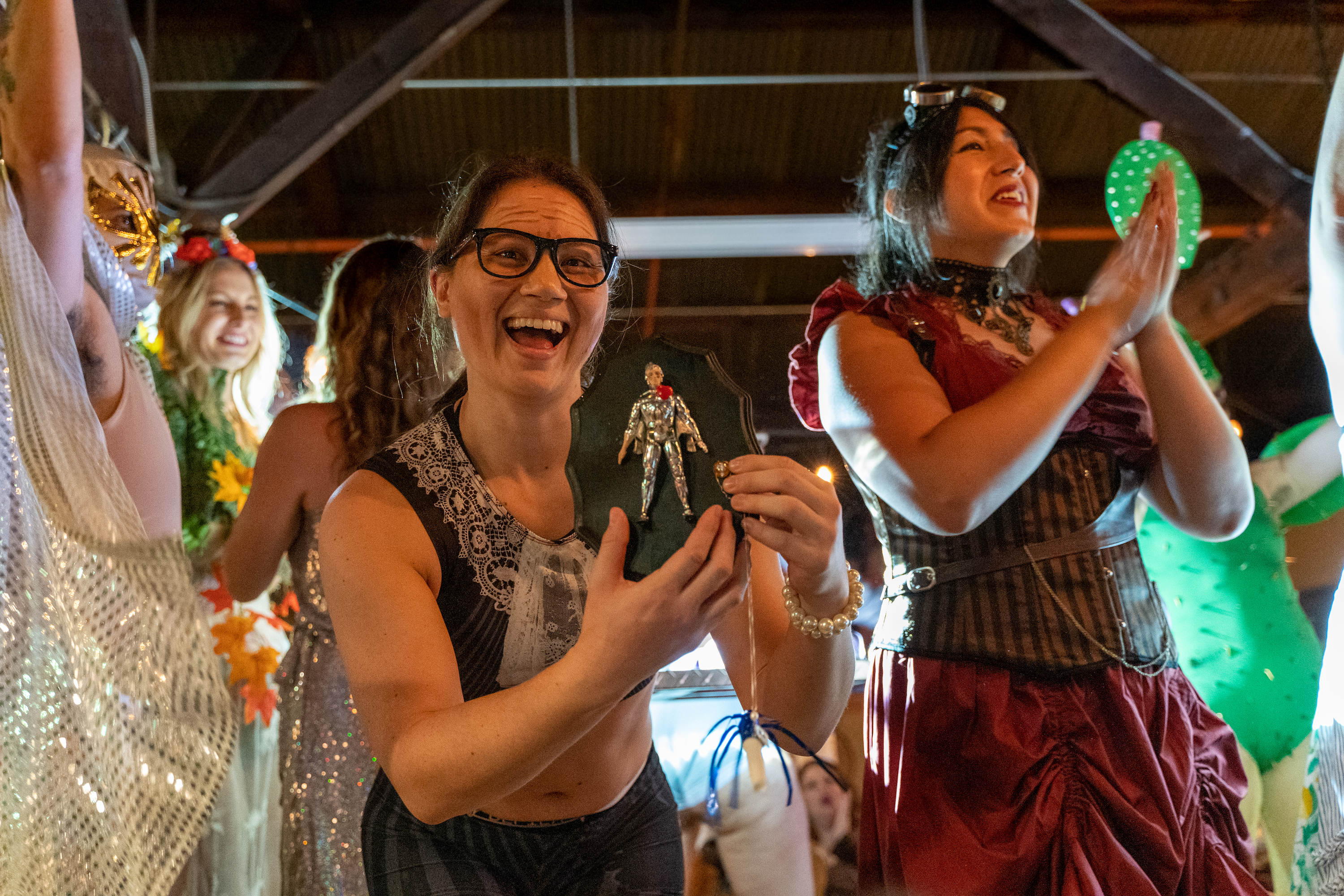 women enjoying an arm wrestling league performance