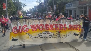 Foodora couriers march in the Labour Day parade in Toronto in 2019.