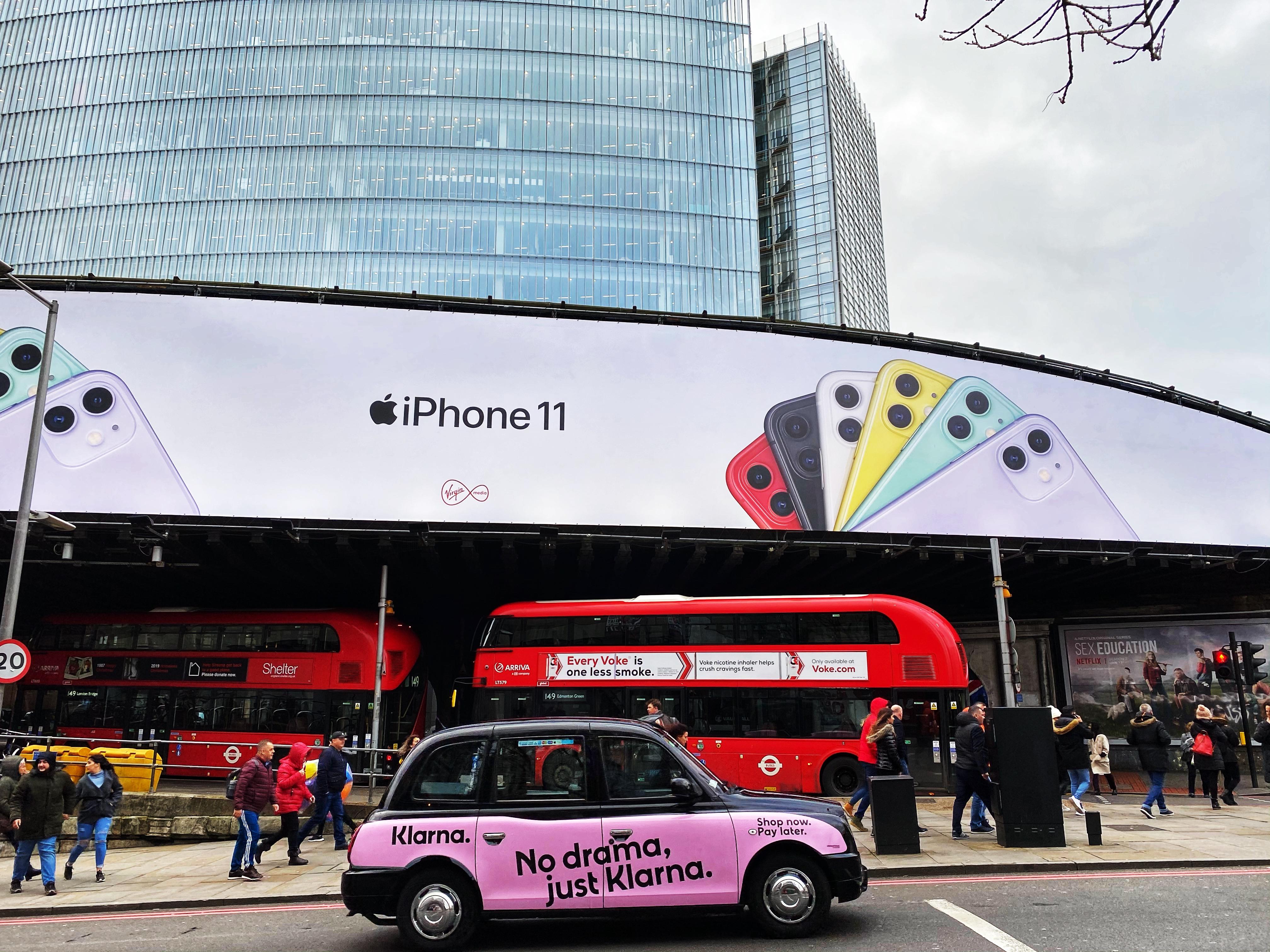 Klarna advertising on a black cab in London