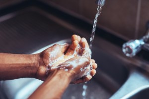 washing hands at sink