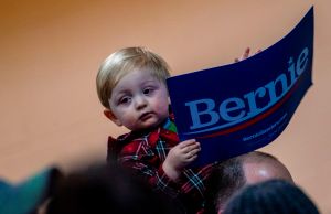 A child holding a Bernie sign.